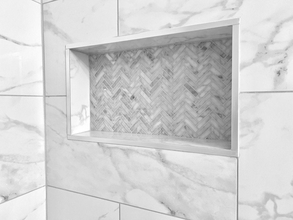 Herringbone mosaic tile niche detail