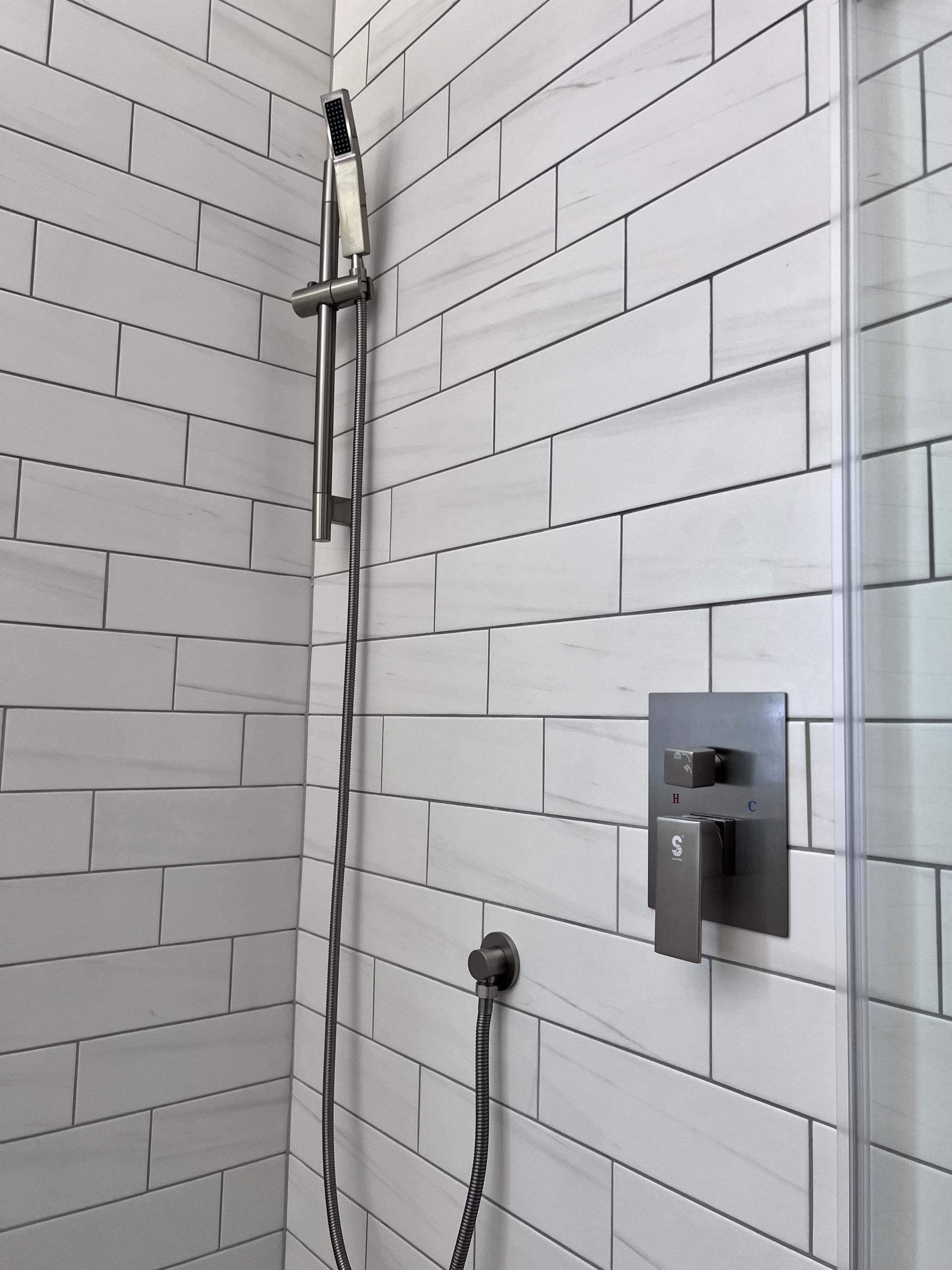 Spacious walk-in shower by Dyson Contracting